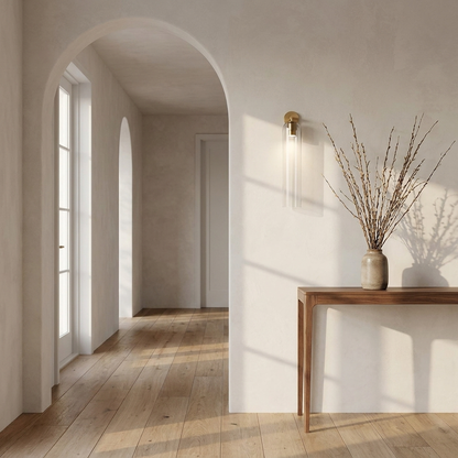 Lumira wall sconce in a plaster hallway